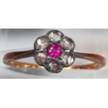 18ct gold diamond and ruby daisy ring. 2g approx. Size M1/2. (B.P. 21% + VAT)