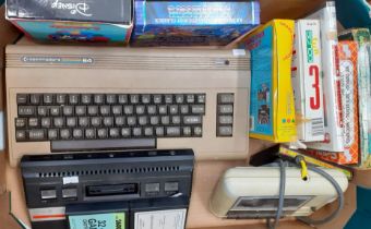 Commodore 64 with datassette, Atari 2600 console and various games including: The Hobbit (no