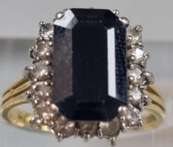 18ct gold diamond and black stone ring (possibly sapphire). 4.3g approx. Size L1/2. (B.P. 21% + VAT)