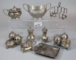 Collection of mainly silver items to include boat shaped two handled sucrier, condiments, card