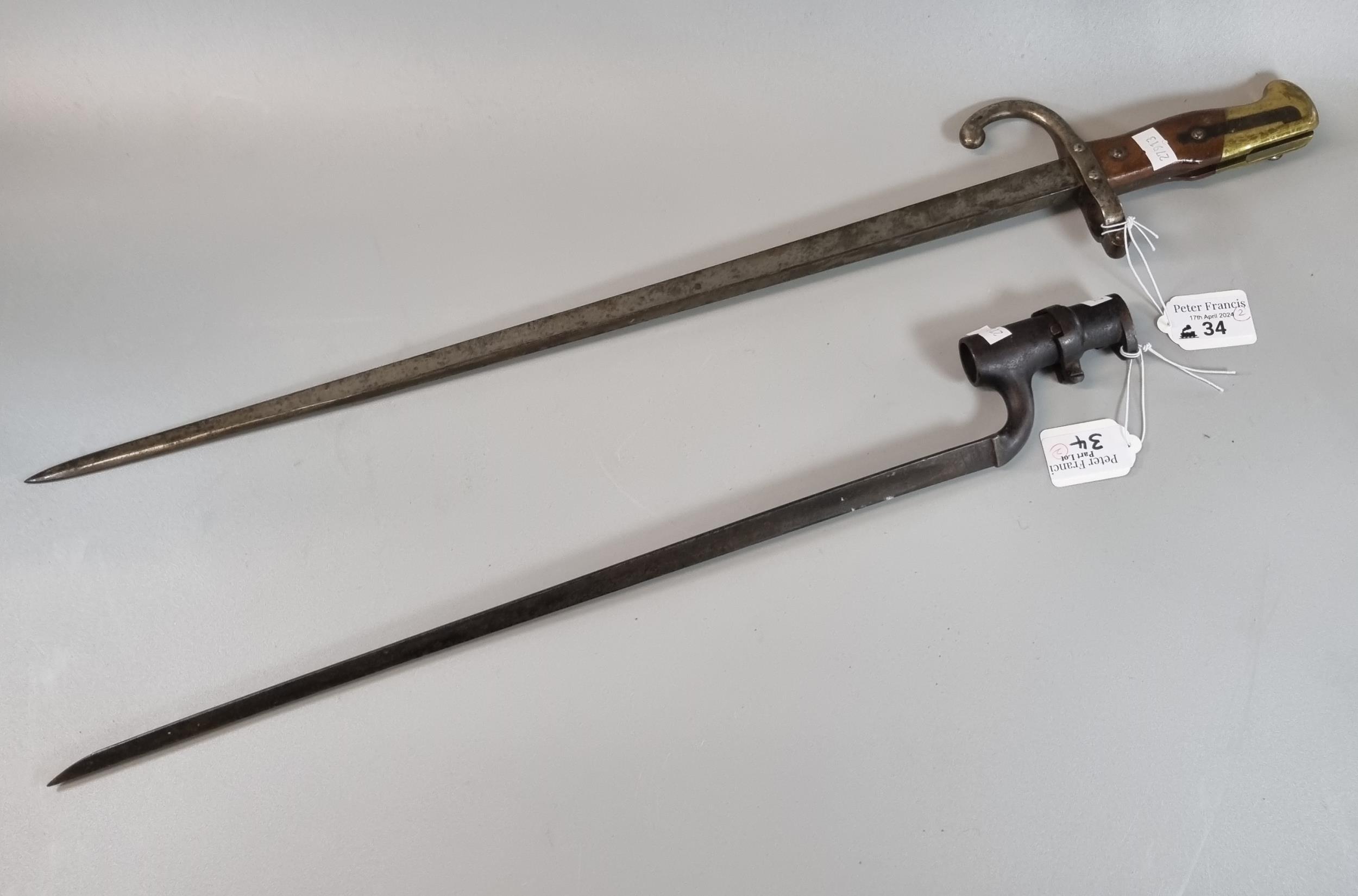 19th century triangular bladed spike bayonet together with a 19th century French sword bayonet