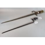 19th century triangular bladed spike bayonet together with a 19th century French sword bayonet