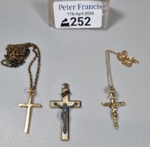 Two 9ct gold chains with crucifix pendants together with another crucifix pendant. 6.4g approx. (B.