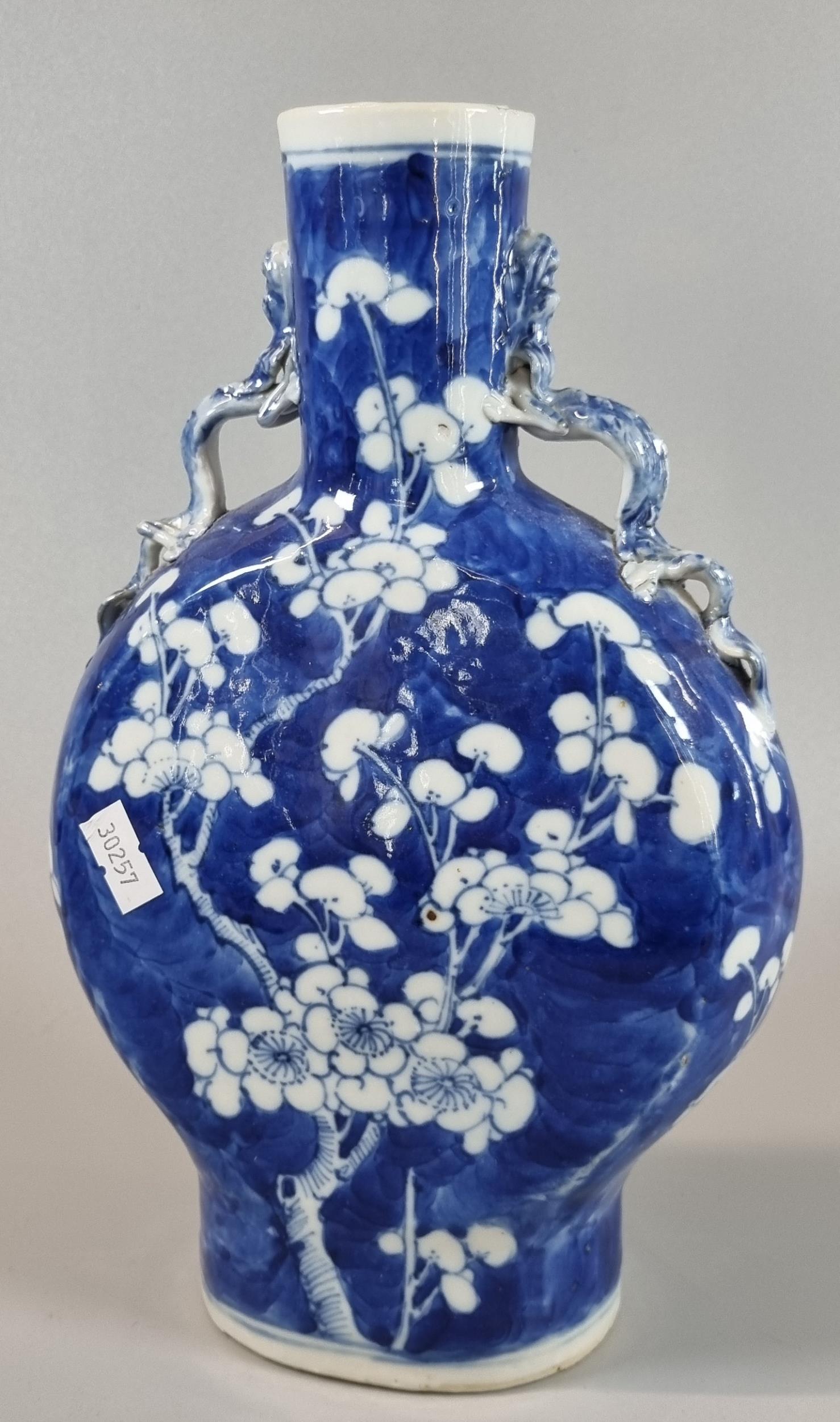 19th century Chinese export porcelain blue and white moon flask, depicting flower and prunus