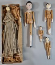 Collection of 19th century Grodnertal peg dolls, all with painted faces, one in particular with