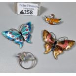 Two silver and enamel brooches in the form of butterflies together with another enamel bird brooch