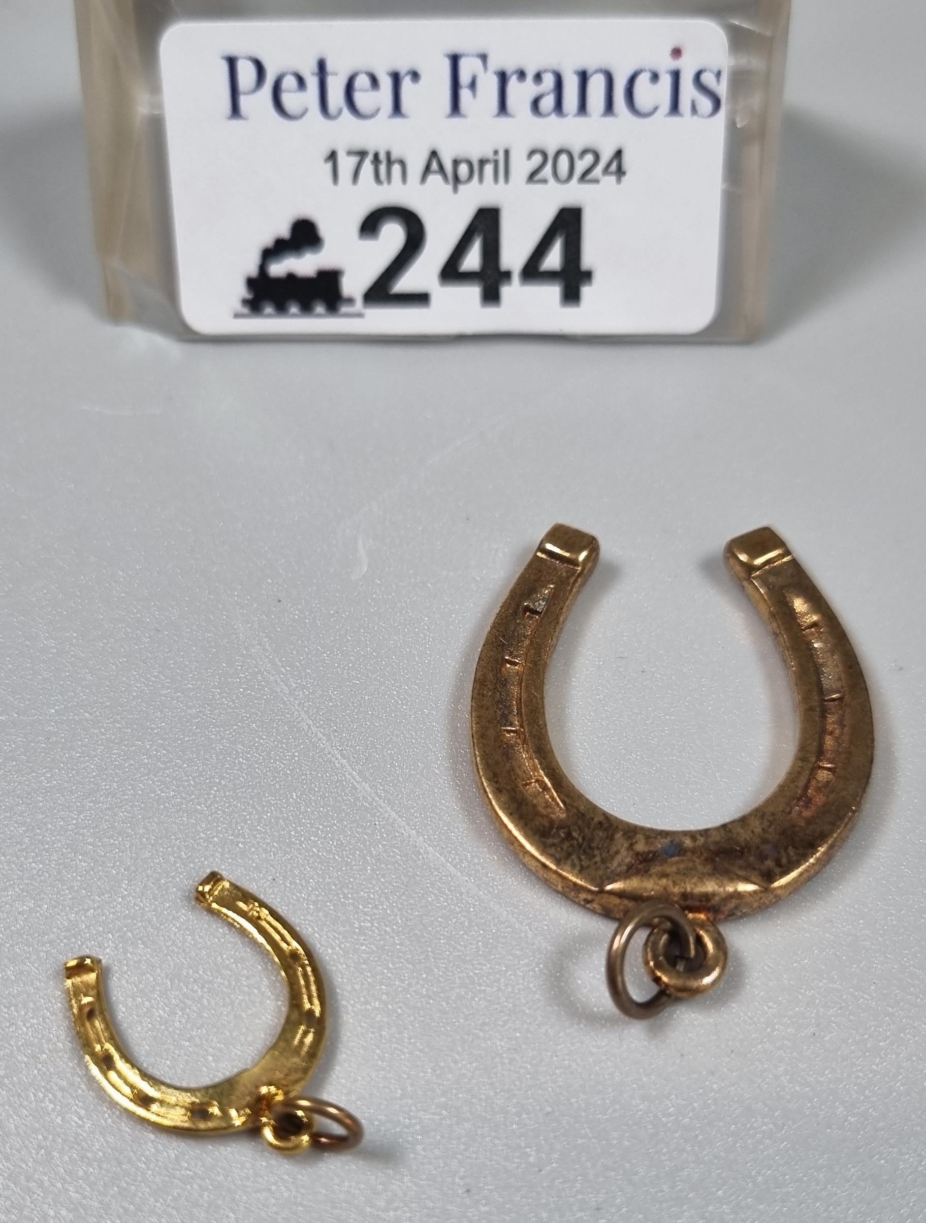 Two 9ct gold horseshoe charms. 8.2g approx. (B.P. 21% + VAT)