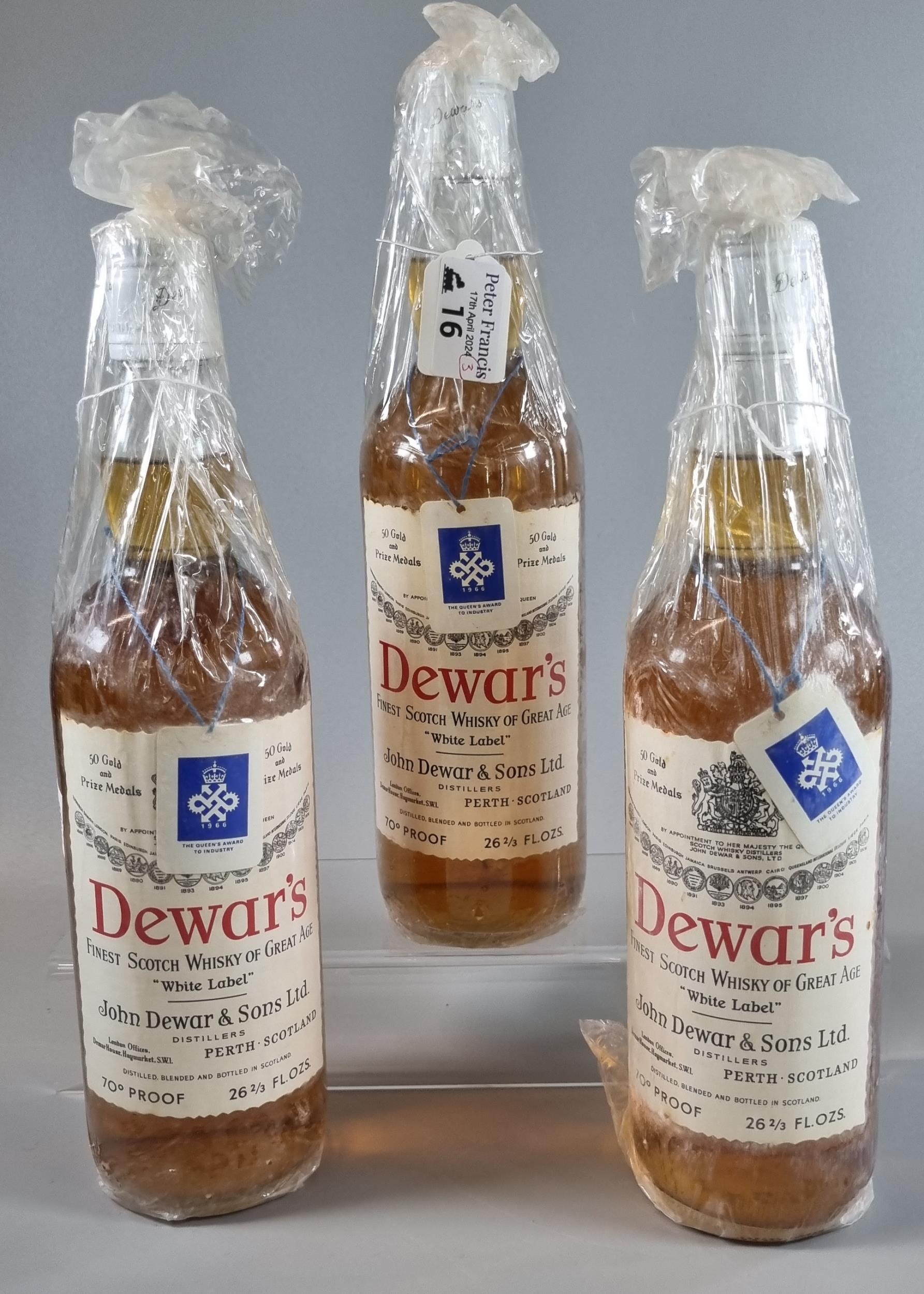 Three bottles of vintage Dewar's Finest Scotch Whisky of Great Age, 'White Label'. 70% proof. 26 2/3