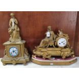 Two 19th century gilt spelter figural mantel clocks, both with ceramic Roman faces, one on