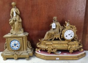 Two 19th century gilt spelter figural mantel clocks, both with ceramic Roman faces, one on