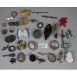 Plastic tub of assorted Victorian costume and other broches, some silver: floral designs, novelty