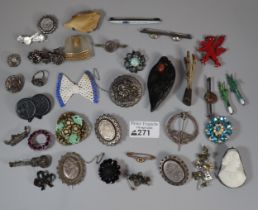 Plastic tub of assorted Victorian costume and other broches, some silver: floral designs, novelty