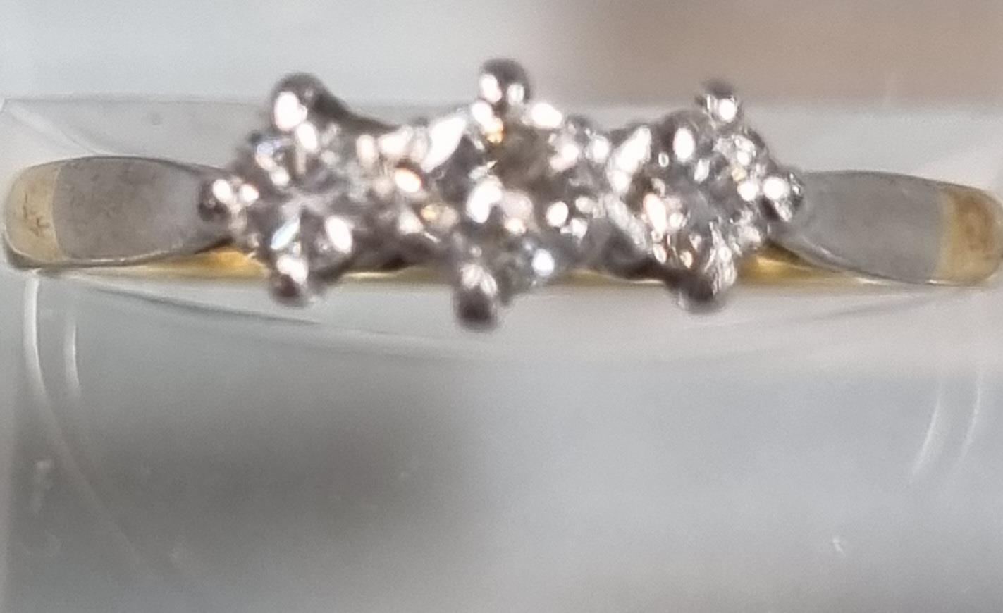 18ct gold diamond three stone ring. 1.7g approx. Size N1/2. (B.P. 21% + VAT)