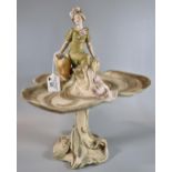 Royal Dux Trefoil Art Nouveau comport with flower-girl seated at the top on an organic design