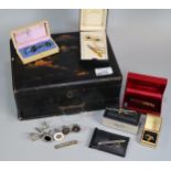 Japanese lacquered workbox, the interior revealing assorted items including: various cufflinks in