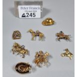 Collection of equestrian and horse racing 9ct gold and other charms. The gold 12.6g approx. Total