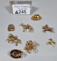 Collection of equestrian and horse racing 9ct gold and other charms. The gold 12.6g approx. Total