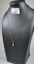 9ct gold fine link chain with diamond and ruby flowerhead pendant. 4.2g approx. (B.P. 21% + VAT)