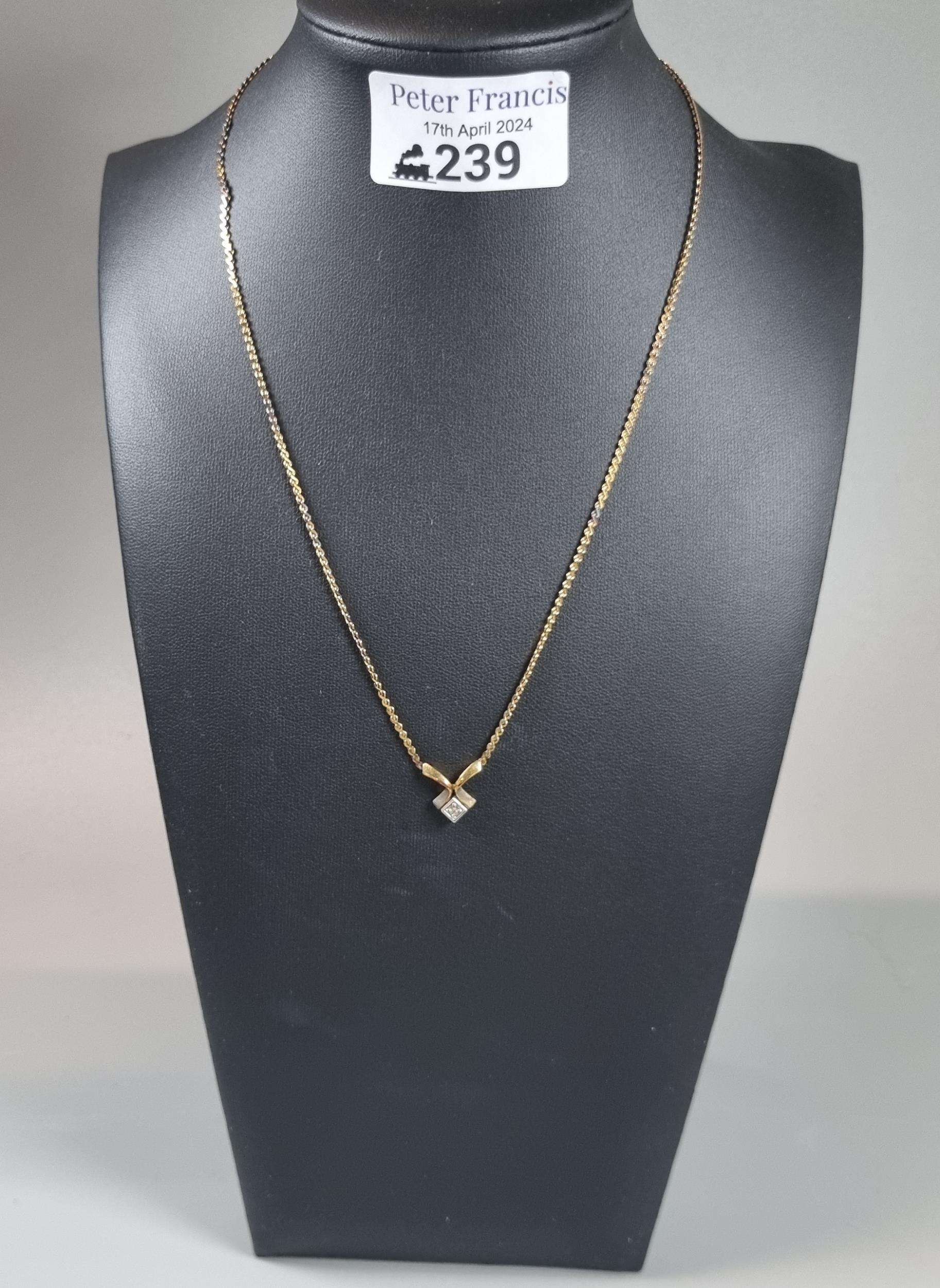 9ct gold chain with small pendant. 5g approx. (B.P. 21% + VAT)