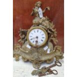 Late 19th century French gilt metal single train mantel clock with figural mount and enamel Roman