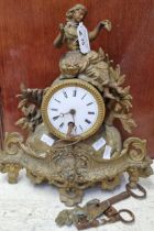 Late 19th century French gilt metal single train mantel clock with figural mount and enamel Roman