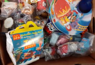 Three boxes of toys to include: McDonalds Happy Meal toys and similar items. (3) (B.P. 21% + VAT)
