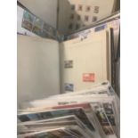 Plastic box with all World stamps in albums and quantity of Great Britain First Day Covers in