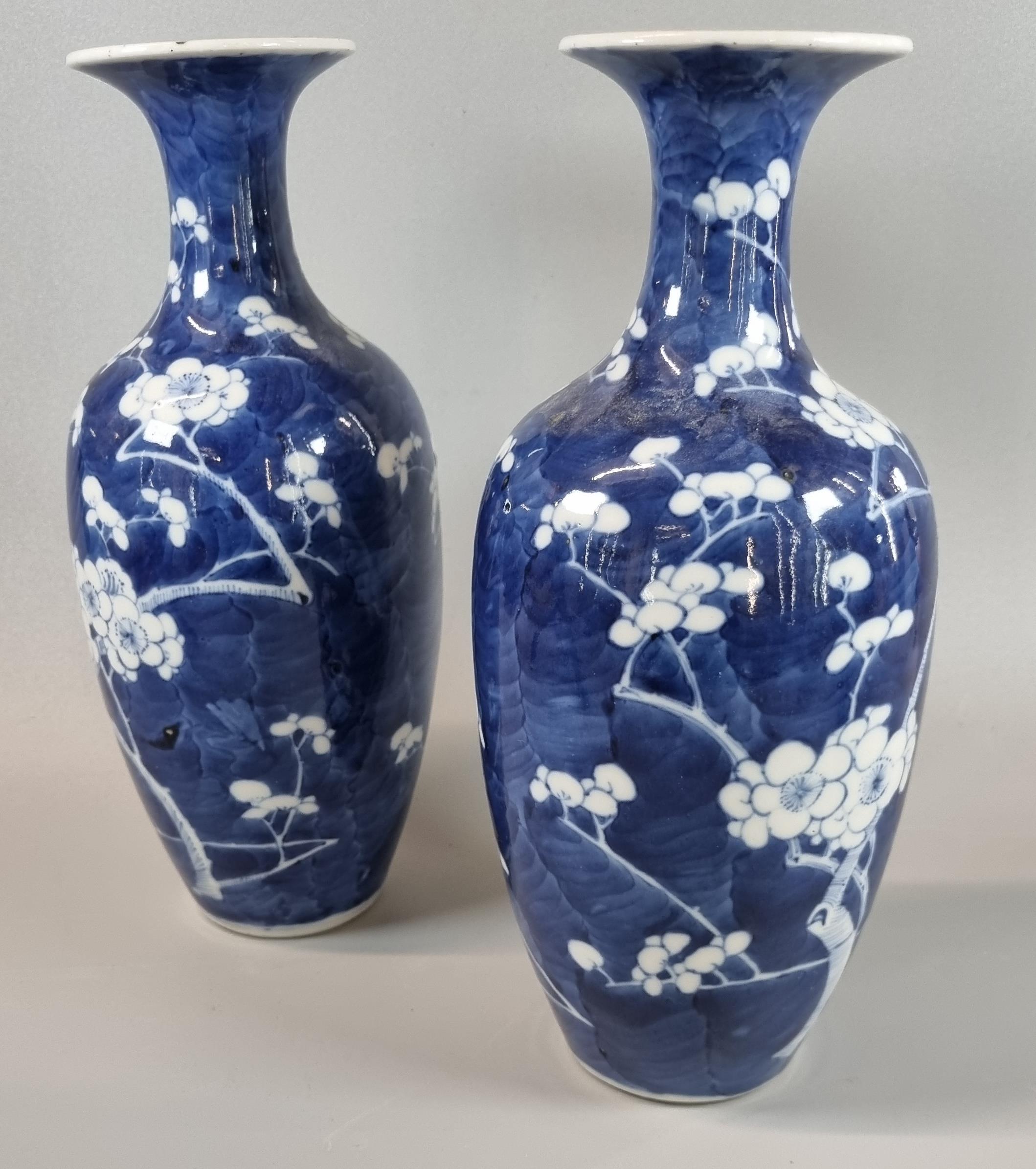 Pair of Chinese export porcelain blue and white baluster vases depicting flower and prunus