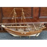 Wooden scale model of an Arab Dhow sailing vessel. 64cm long approx. (B.P. 21% + VAT)