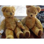 Two similar mid century mohair teddy bears with bells in ears, stitched nose, glass eyes and