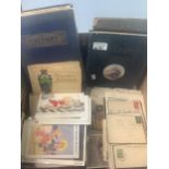 Postcards selection in box together with two stamp albums and various covers including mourning