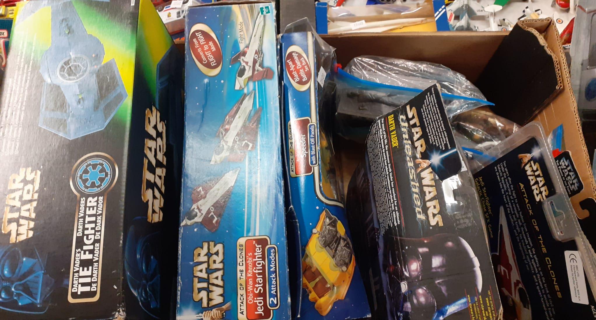 Box of assorted Star Wars items to include: Chewbacca figurines in original packaging, Star Wars