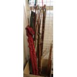 Large collection of assorted Greenheart split cane and other fishing rods, some with canvas cases,