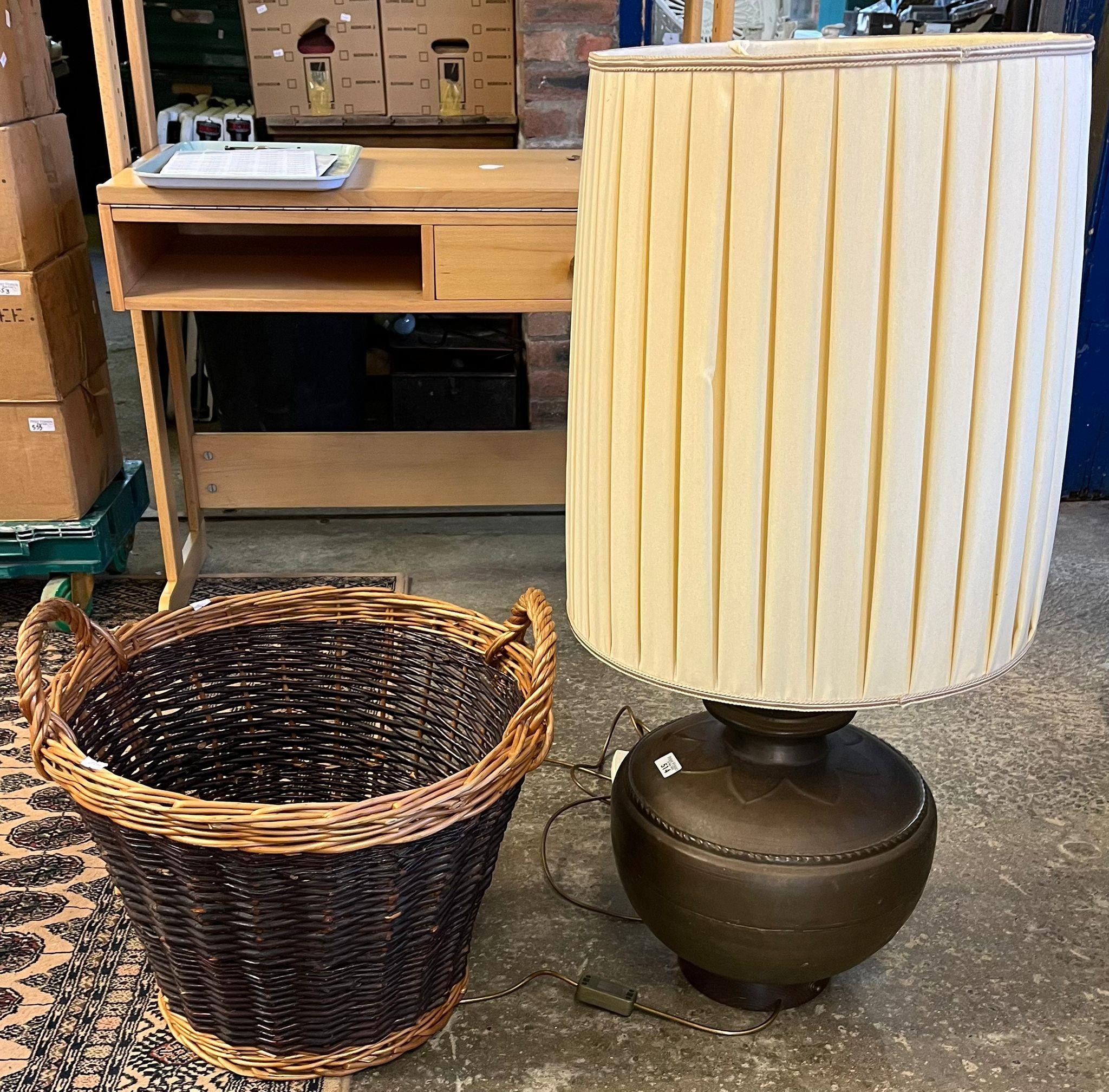 Two handled wicker basket together with a bronzed metal baluster table lamp with shade. (B.P.