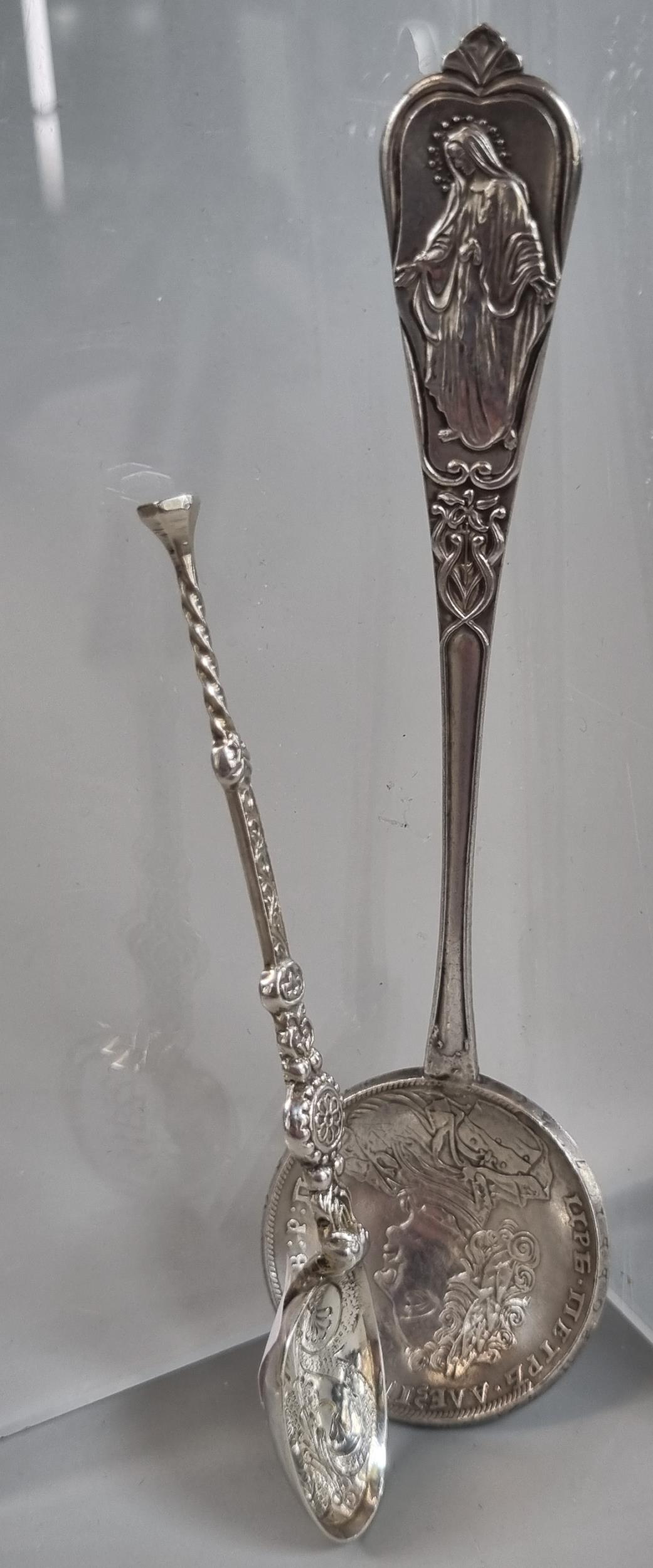 Religious continental silver spoon with coin bowl. 1.3 troy oz approx. together with a miniature