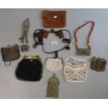 Collection of assorted jewellery items: beadwork and mesh bags, leather and bead necklaces, white