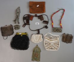 Collection of assorted jewellery items: beadwork and mesh bags, leather and bead necklaces, white