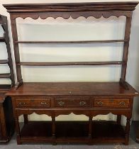 19th century oak two stage pot board dresser, the moulded cornice above open rack, projecting base