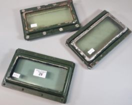 Group of three heavy and thickly glazed ferret armoured car side viewing ports with metal frames. (