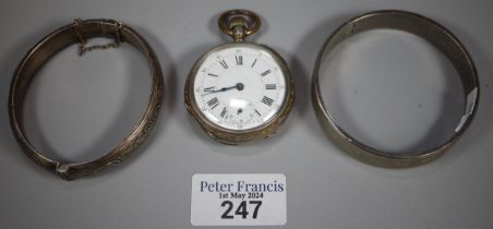 Swiss white metal open faced keyless pocket watch with Roman face and seconds dial together with two