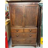 19th century oak two stage press cupboard, the moulded cornice above two blind panelled doors, the