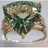 9ct gold 'Kiwi' green topaz and white sapphire ring. Sri Lankan origin. 14.275 carat weight. Size R.