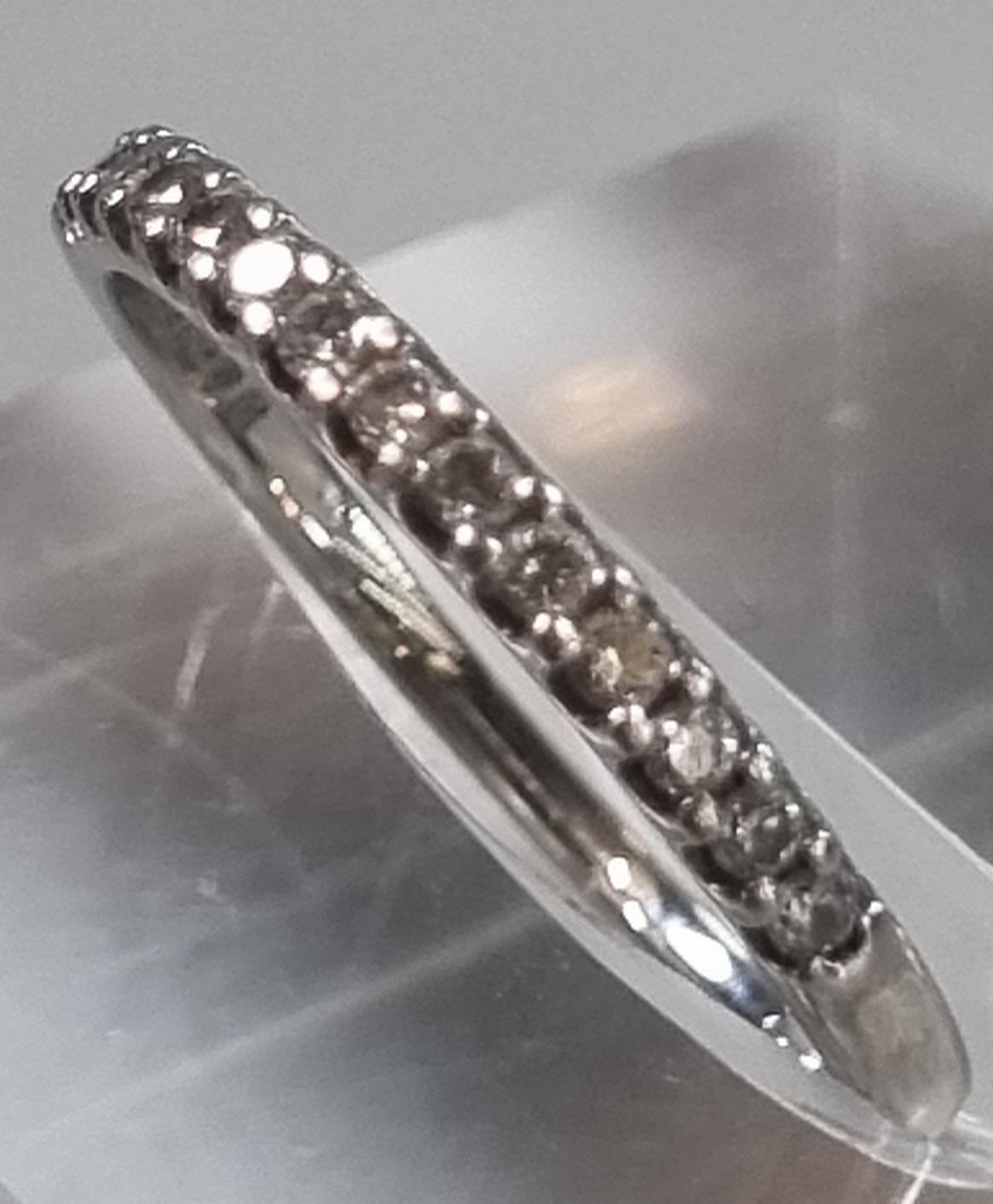 Modern platinum and diamond half eternity ring marked 'Pravins', in Pravins ring box. 1.6g approx. - Image 2 of 4