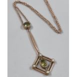 Edwardian 9ct gold peridot and seed pearl pendant on fine link chain. 2.8g approx. (B.P. 21% + VAT)