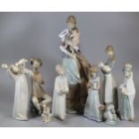 Group of nine Spanish porcelain Lladro figurines to include: 'Peaceful Moment' depicting a mother