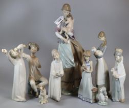 Group of nine Spanish porcelain Lladro figurines to include: 'Peaceful Moment' depicting a mother