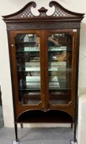 Edwardian mahogany two door display cabinet, having brass swan neck pediment above fitted glass