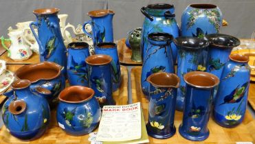 Two trays of Torquay pottery blue ground kingfisher design items; vases, cylinder jugs, pots etc,