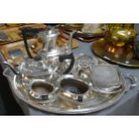 Oval two handled silver plated tray containing various silver plated items; a four piece bachelors