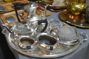 Oval two handled silver plated tray containing various silver plated items; a four piece bachelors